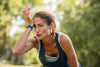 active senior woman sweating after running in the summer heat.